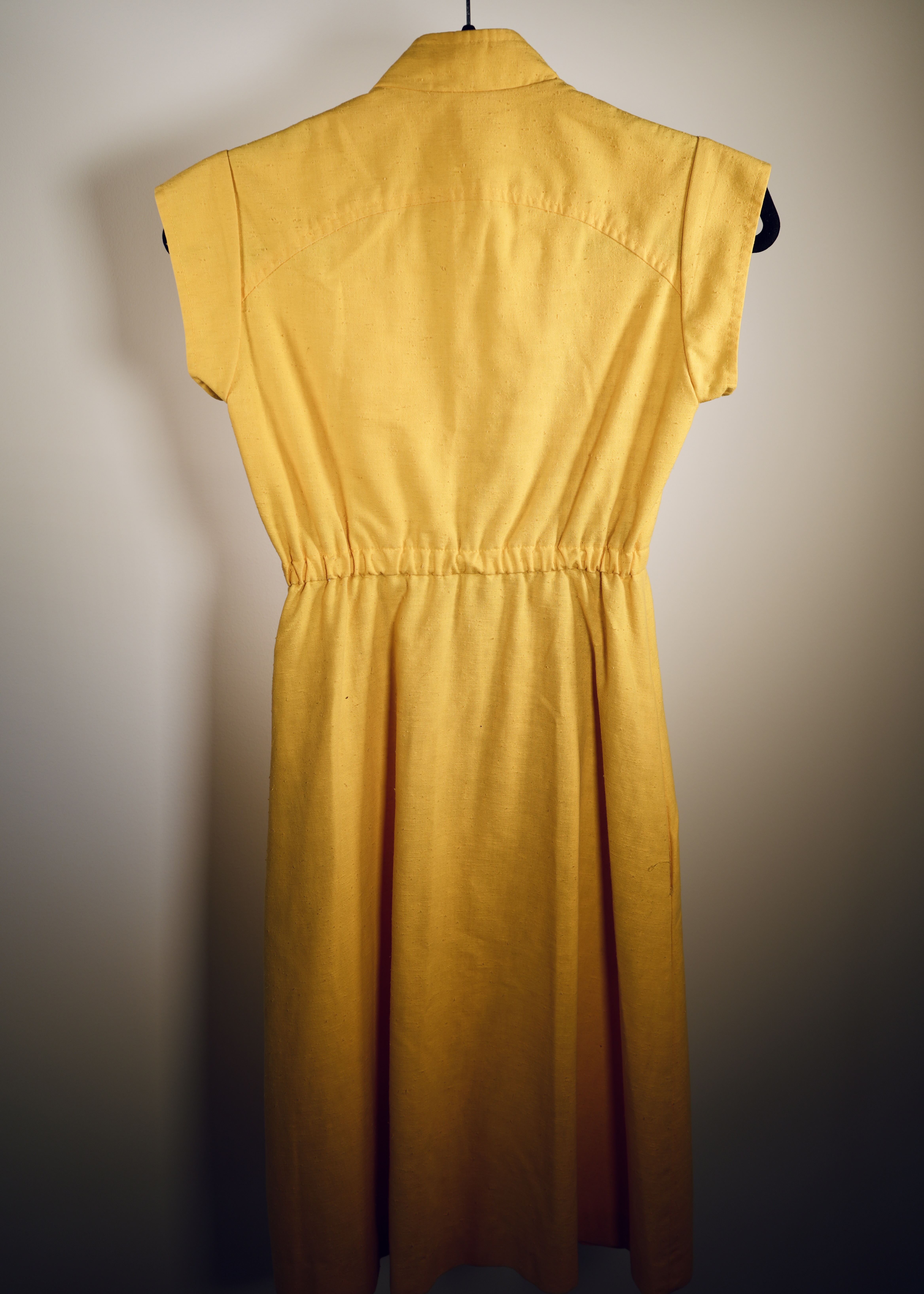 Mustard yellow sleeveless button-front dress